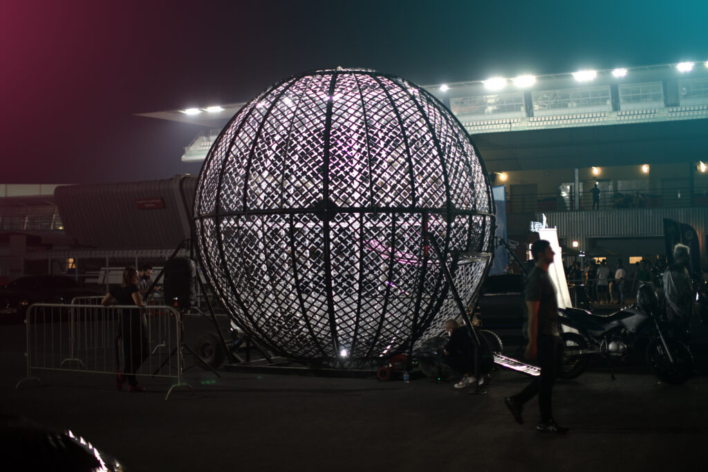 Honda commercial shoot featuring the Danger Globe with motorcycle riders mid-stunt